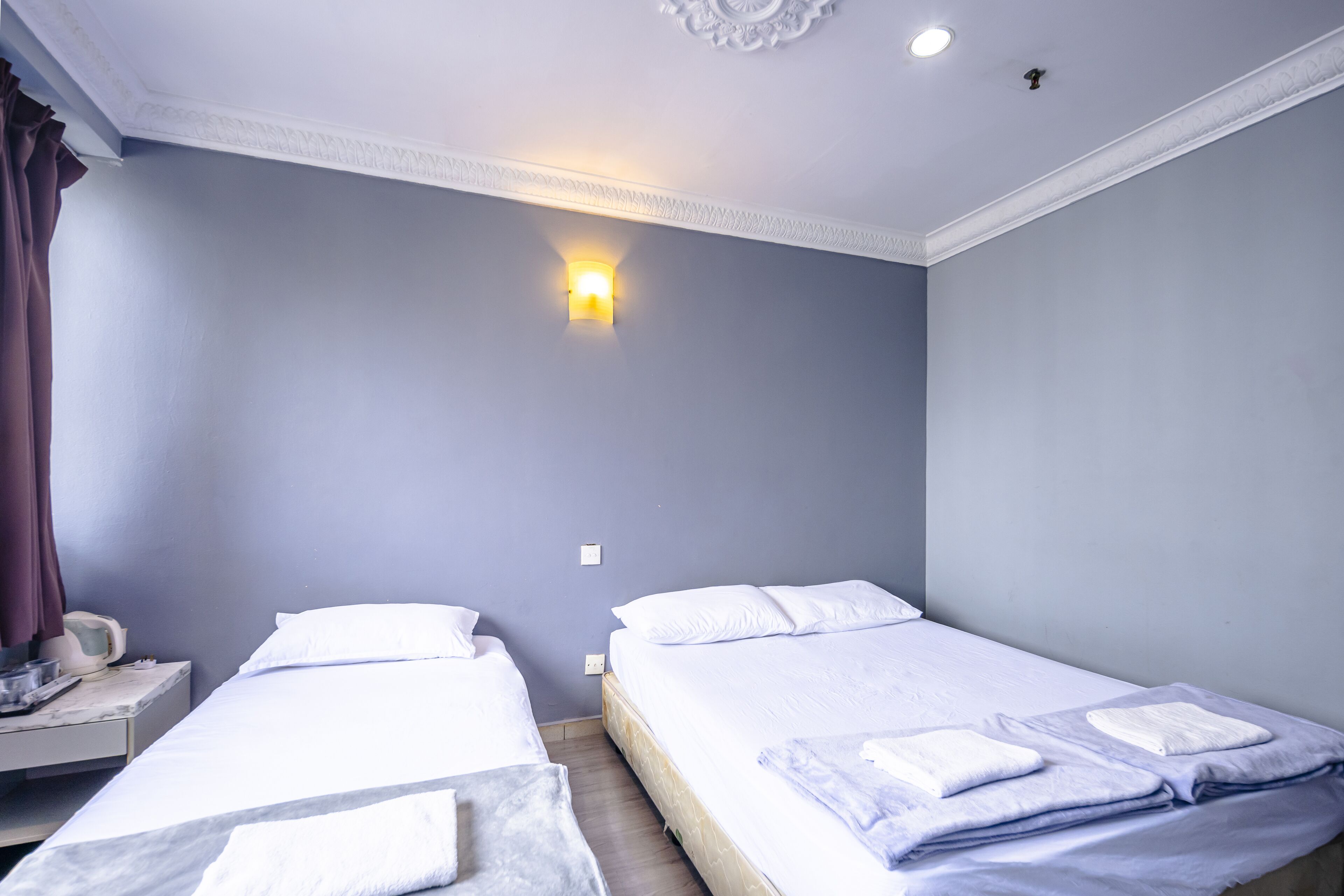 Triple Room | Desk, blackout drapes, free WiFi, bed sheets