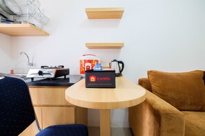 Room | Private kitchen | Fridge, stovetop, rice cooker, cookware/dishes/utensils - Cozy 2BR Bassura City Apartment with City View (Jakarta)