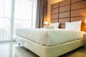 Desk, free WiFi, bed sheets - Luxurious 1BR At Dago Suites Apartment (Bandung)