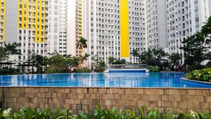 Outdoor pool - Minimalist Studio Room at The Springlake Apartment Sumarecon Bekasi (Bekasi)