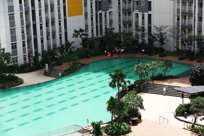 Outdoor pool - Minimalist Studio Room at The Springlake Apartment Sumarecon Bekasi (Bekasi)