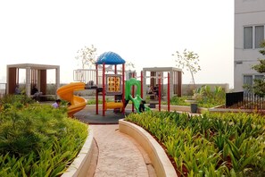 Children’s play area – outdoor - Cozy 2BR Bassura Apartment near Mall Bassura City (Jakarta)