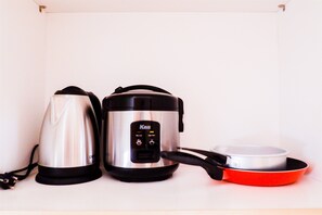 Room | Private kitchenette | Fridge, stovetop, rice cooker, cookware/dishes/utensils - Modern Furnished Studio Room Cinere Bellevue Suites Apartment (Depok)