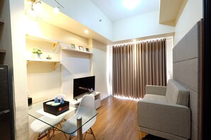 Room | Living room | TV - Brand New 1BR Casa De Parco Apartment (Pagedangan)