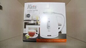A box for a water kettle with capacity markings and a cup of tea illustration. - 2BR Mediterania Palace Kemayoran Apartment (Jakarta)