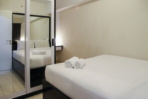 Desk, iron/ironing board, bed sheets - Deluxe and Modern 2BR The Springlake Summarecon Apartment (Bekasi)