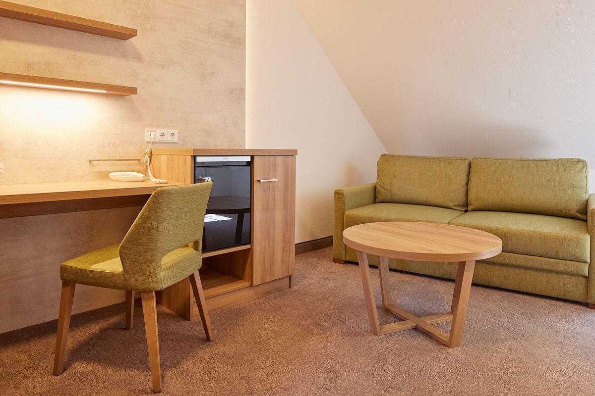 superior double or twin room, non smoking | living area | smart tv