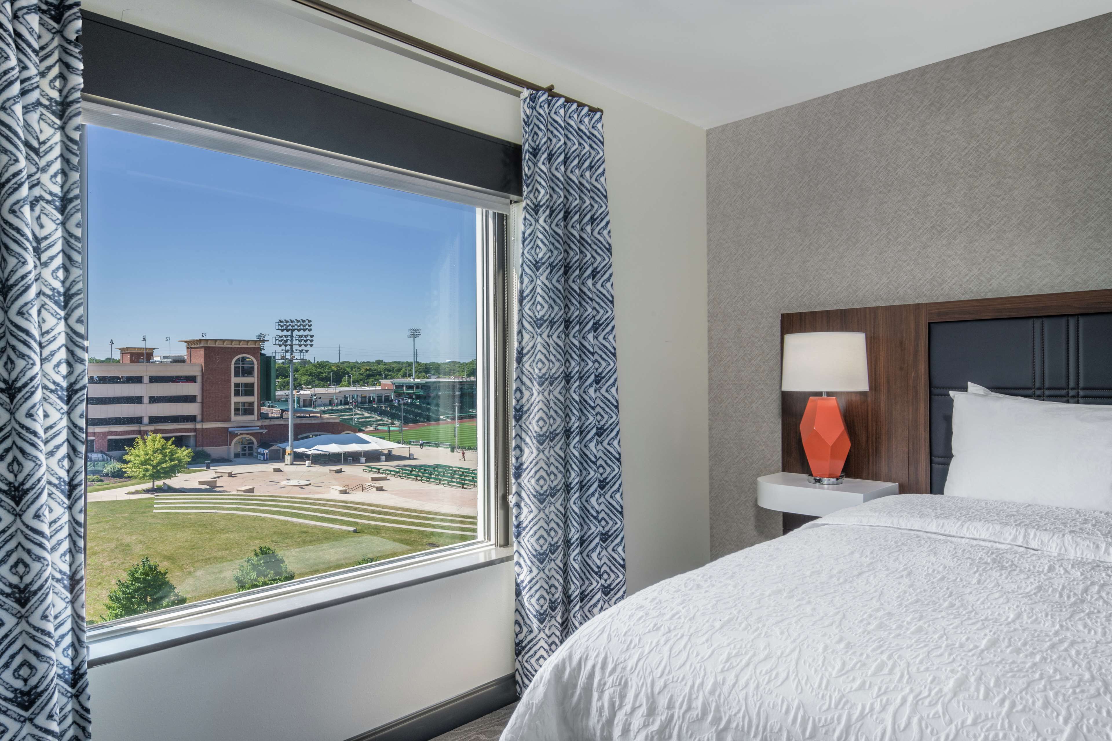 suite, 1 king bed, refrigerator & microwave (wet bar, ballpark view) | in-room safe, desk, iron/ironing board, cots/infant beds