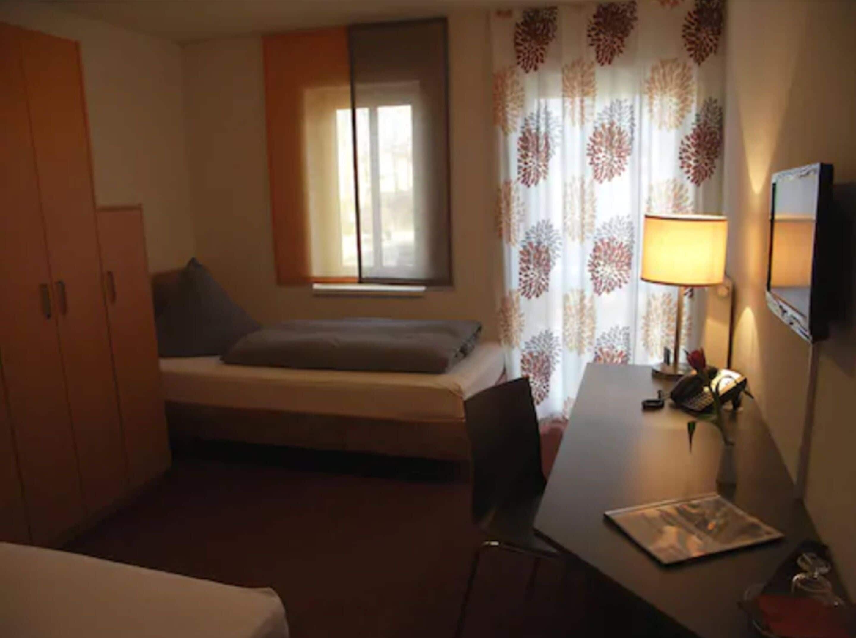 Minibar, desk, blackout curtains, iron/ironing board
