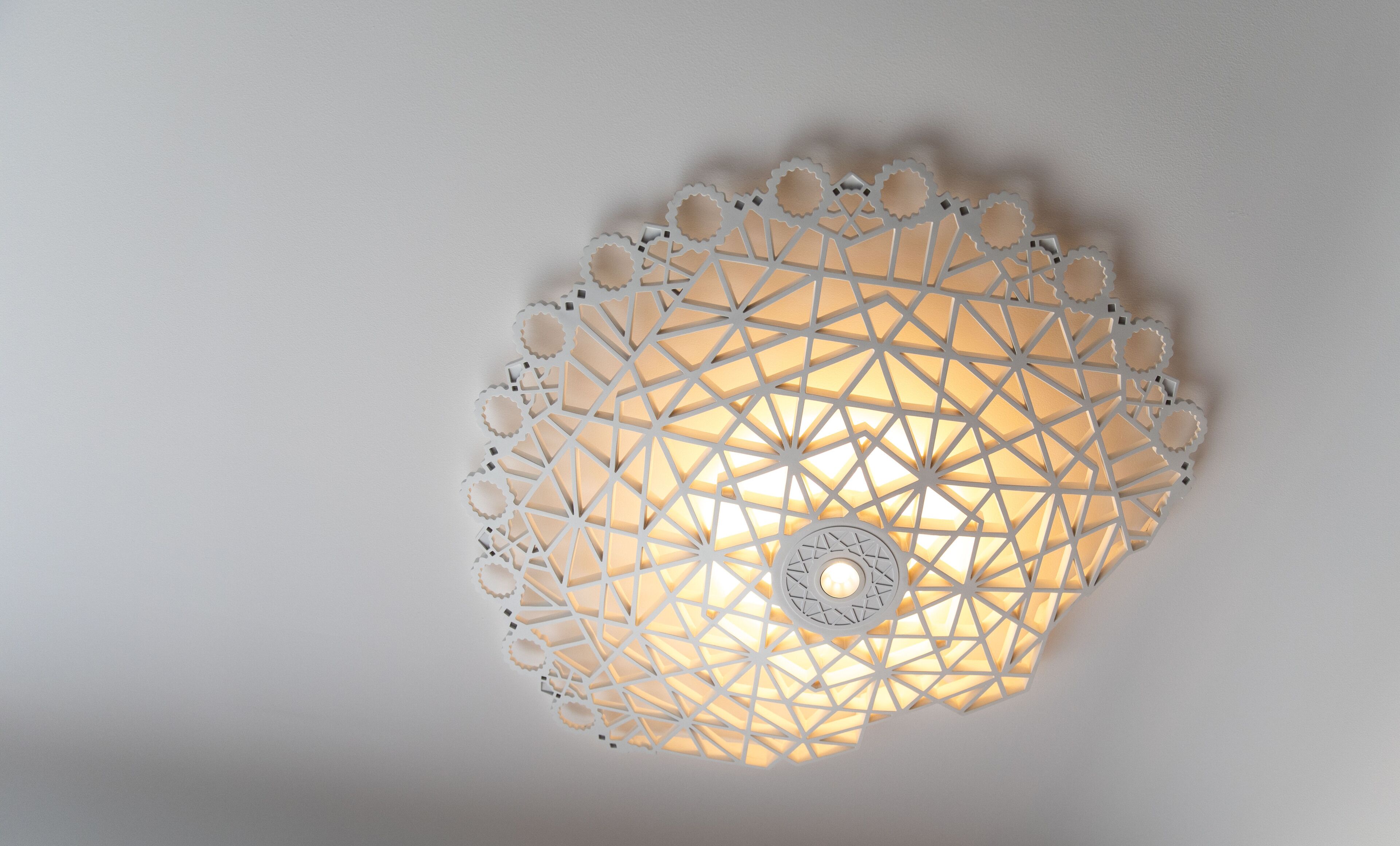 A ceiling light fixture with a geometric design.