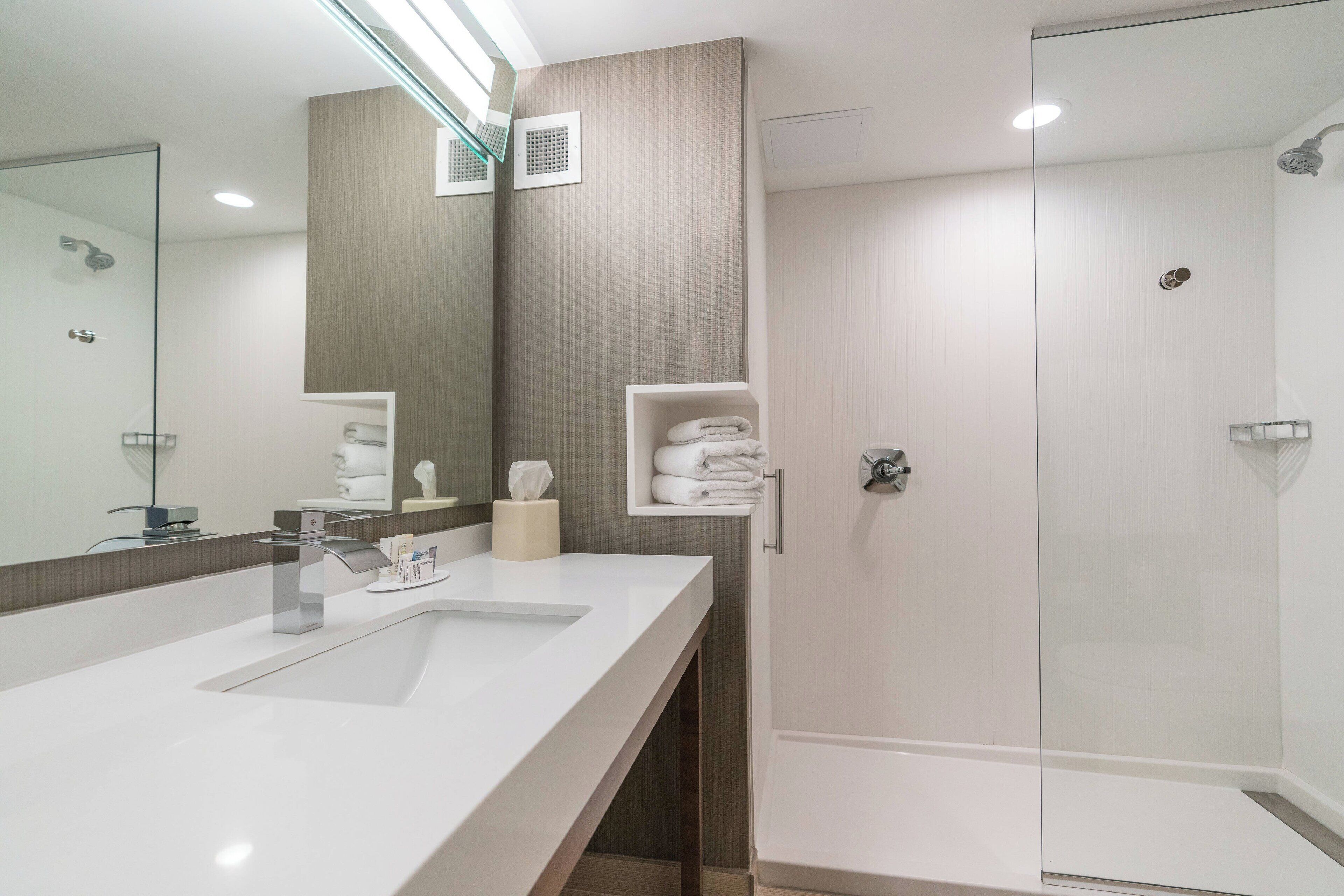 room, 2 queen beds | bathroom | hydromassage showerhead, free toiletries, hair dryer, towels