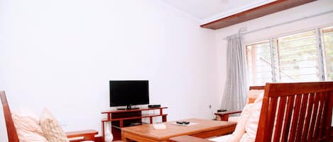 Departamento Premium, 2 camas matrimoniales, para no fumadores, vista al jardín | Área de sala de estar