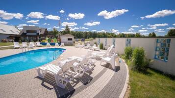 Seasonal outdoor pool, open 10:00 AM to 10:00 PM, pool loungers