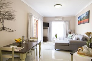 Family Cottage (Lemon Tree) | Living area | 32-inch LED TV with satellite channels, TV