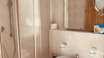 Shower, hair dryer, slippers, towels