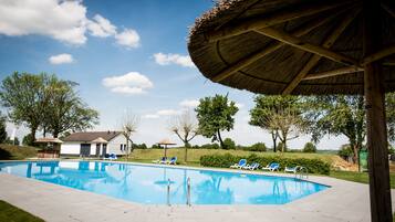 Seasonal outdoor pool, pool loungers