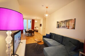 Premium Apartment | Living area | Flat-screen TV