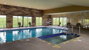 An indoor swimming pool with clear markings for lanes and no diving.