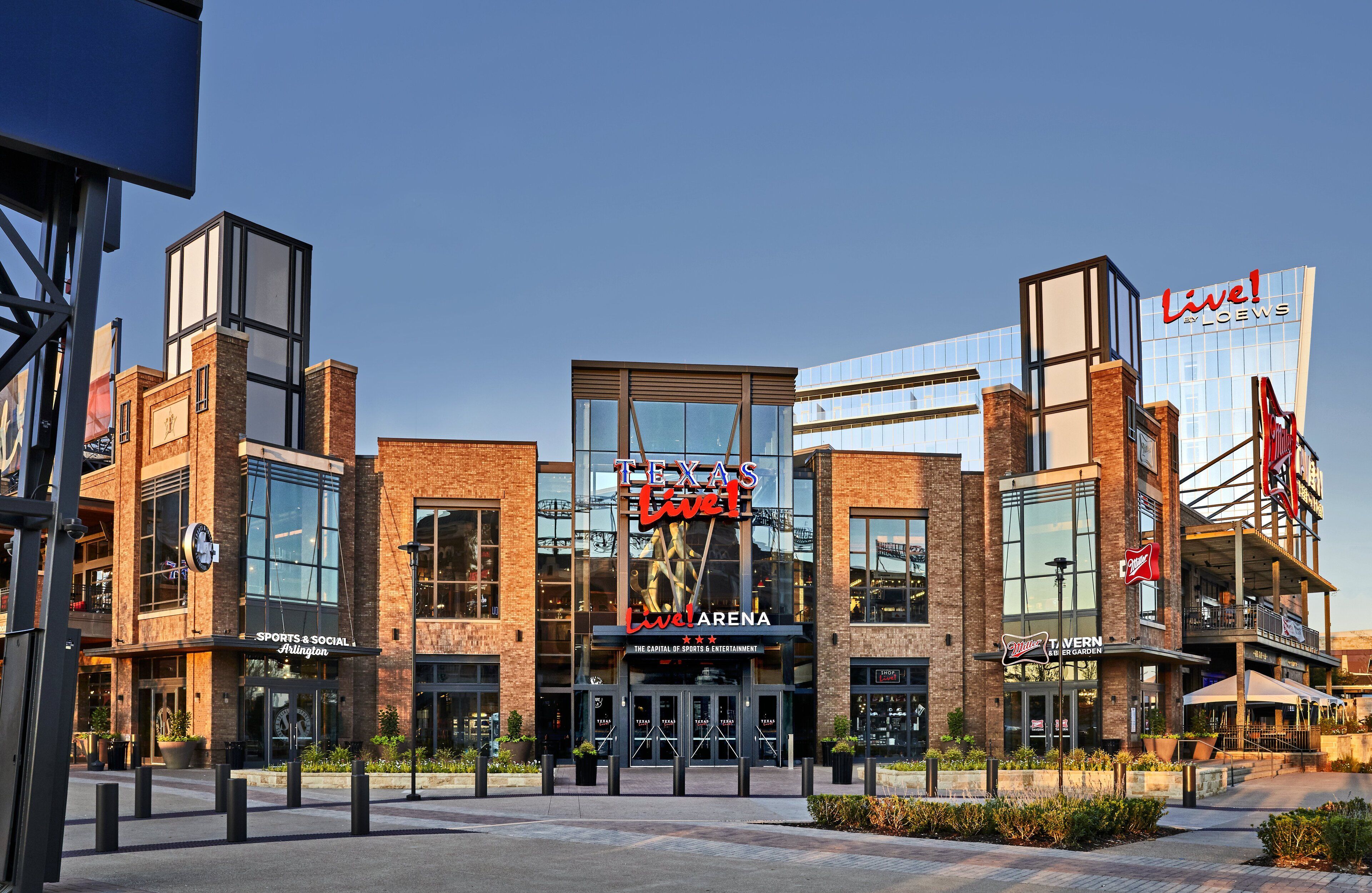 A modern building with a prominent "Texas Live!" sign, featuring a sports and social area, a restaurant, and a garden.