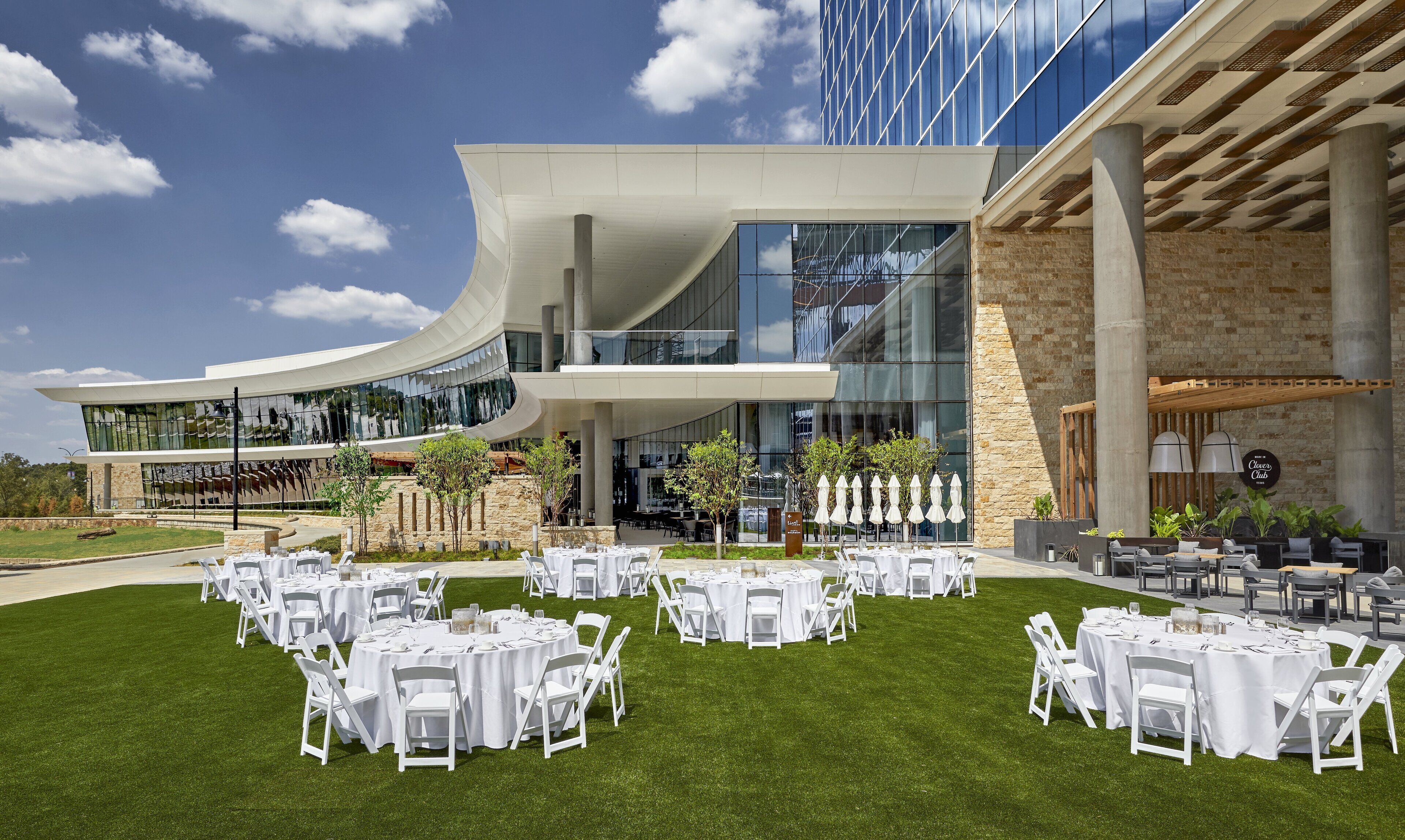 A modern building with a curved facade and large glass windows.