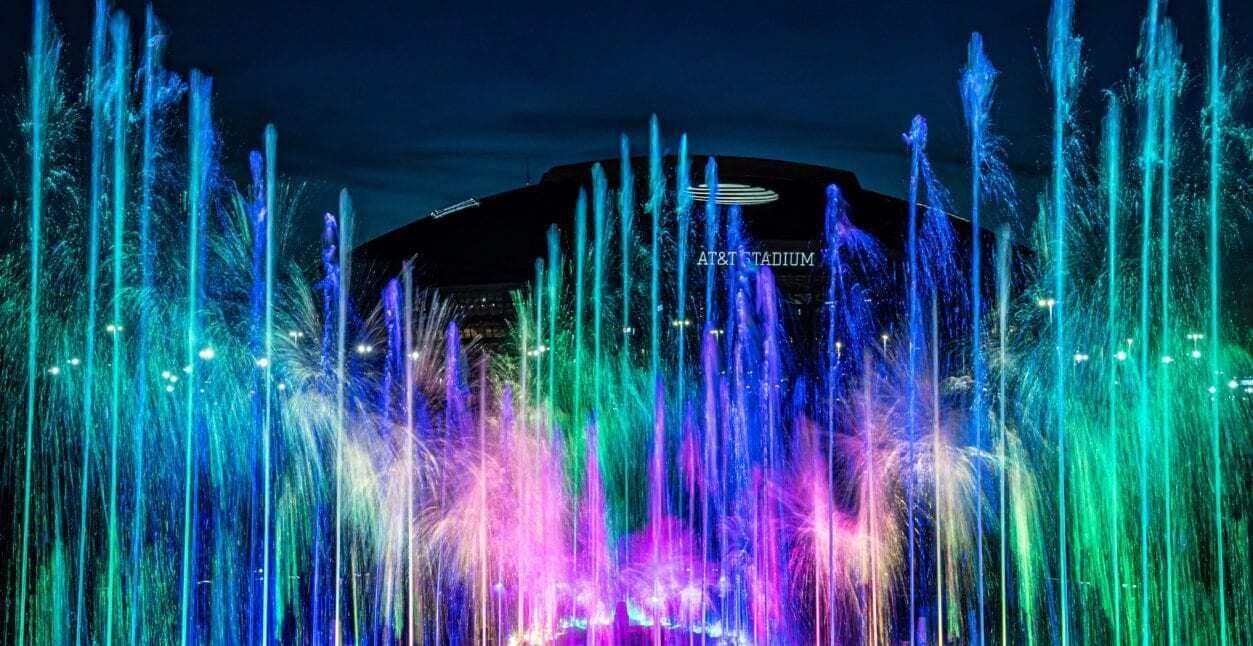 A stadium with a water fountain display.