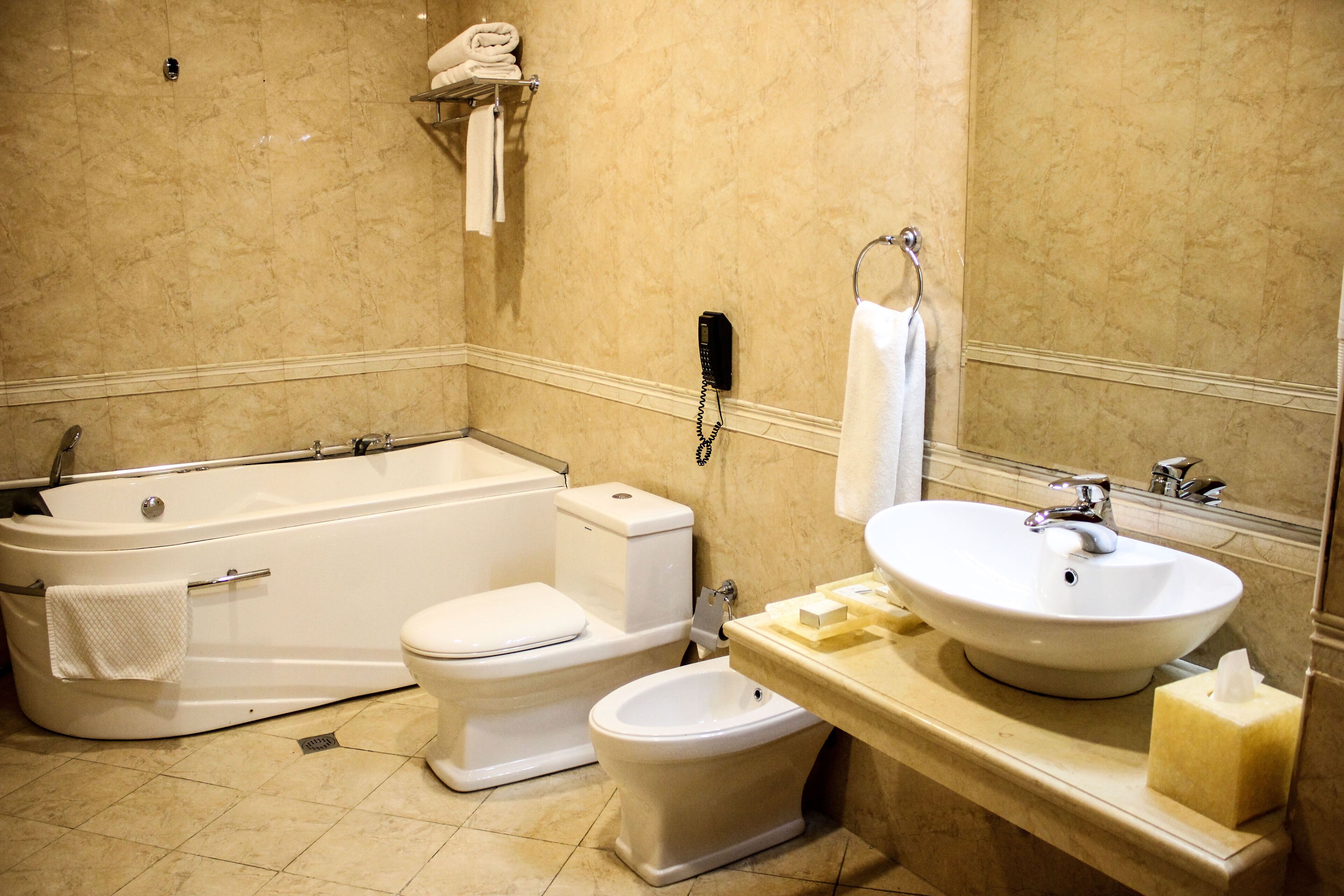 junior suite | bathroom | combined shower/bathtub, hydromassage showerhead, hair dryer, bathrobes