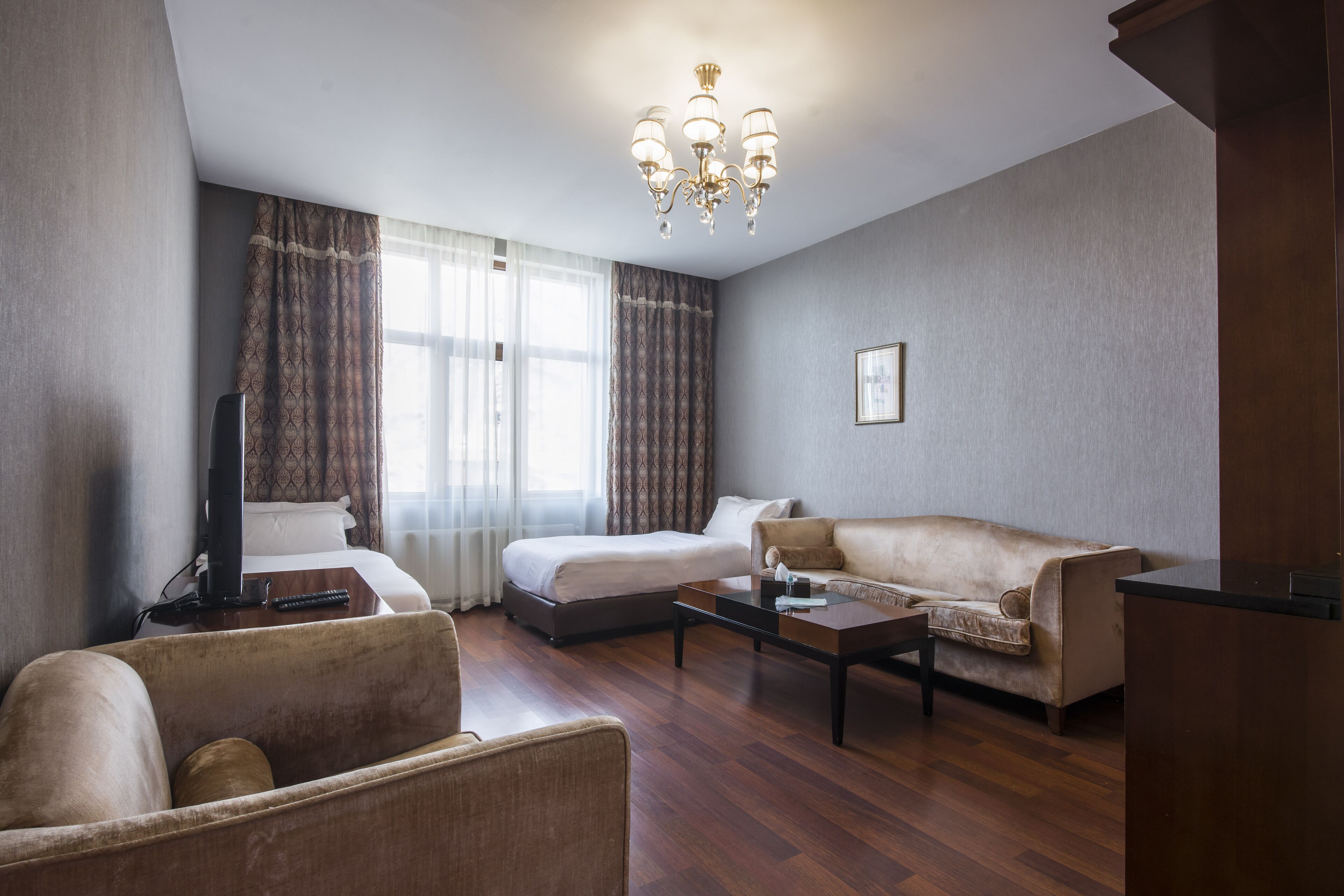 corner suite  | living area | lcd tv, heated floors