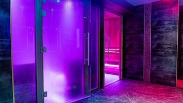 A modern hallway with frosted glass doors and a marble floor.
