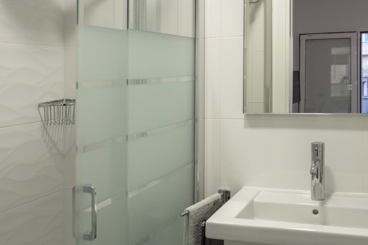 double room, patio | bathroom | shower, slippers, towels