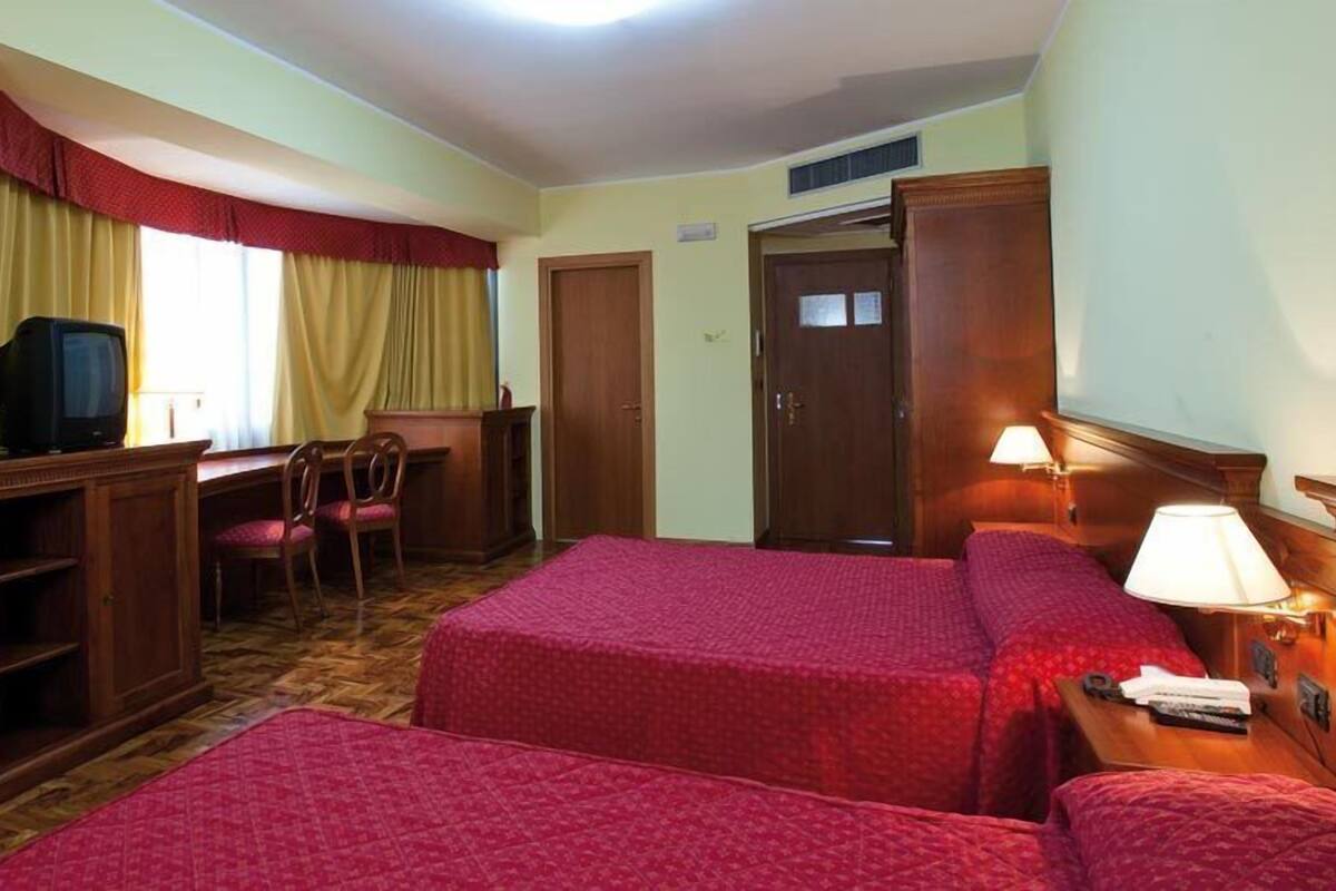 Minibar, desk, blackout curtains, iron/ironing board
