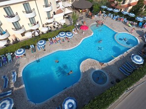 Seasonal outdoor pool, open 9:00 AM to 6:00 PM, pool umbrellas