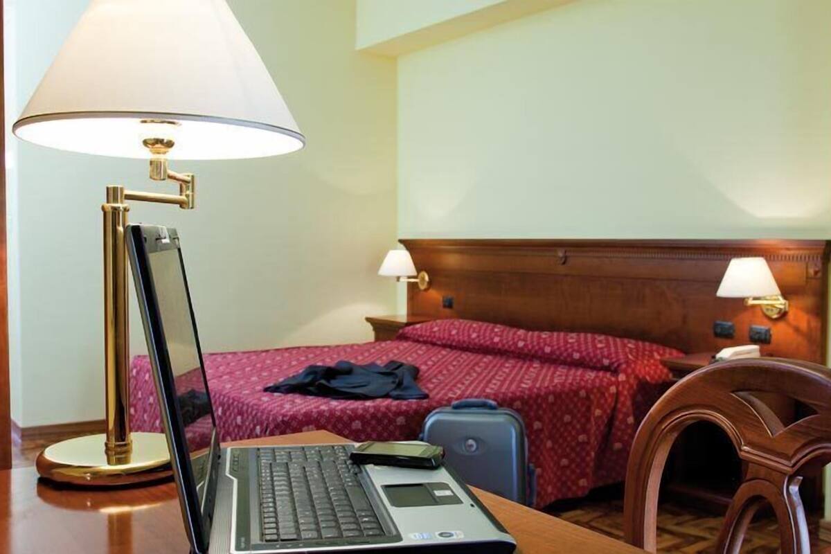 Standard Double Room | Minibar, desk, blackout curtains, iron/ironing board