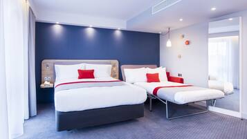 Desk, blackout drapes, iron/ironing board, free cribs/infant beds