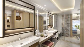 A modern bathroom with two sinks, a large mirror, and a shower area.