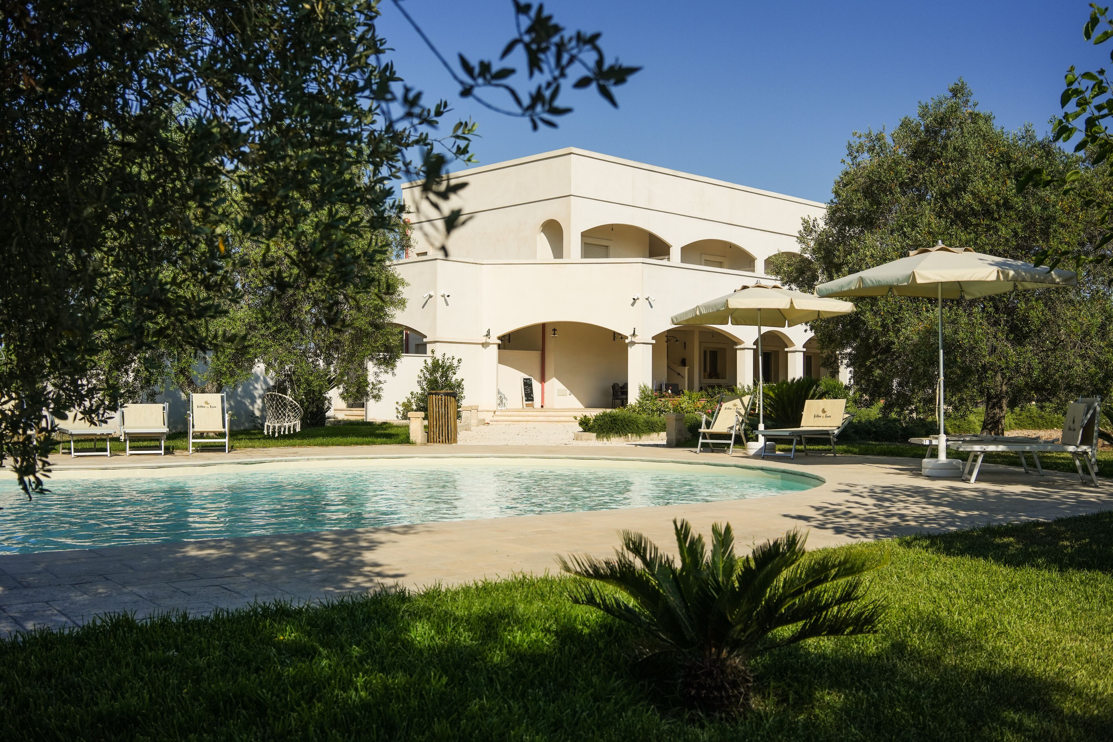 Seasonal outdoor pool, pool umbrellas, pool loungers