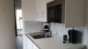 Basic Double Room, Garden View | Shared kitchen facilities - Strandhuset B&B i Abbekås (Abbekas)