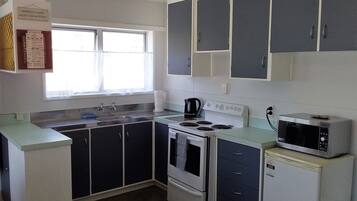 2 Bedroom Unit | Private kitchen | Full-sized fridge, microwave, oven, stovetop