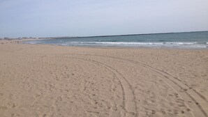A wide sandy beach with gentle waves and a clear sky. - Open Floor Plan, Family Friendly, Waterview Home  (Narragansett)