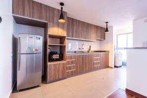 Fridge, microwave, stovetop, coffee/tea maker