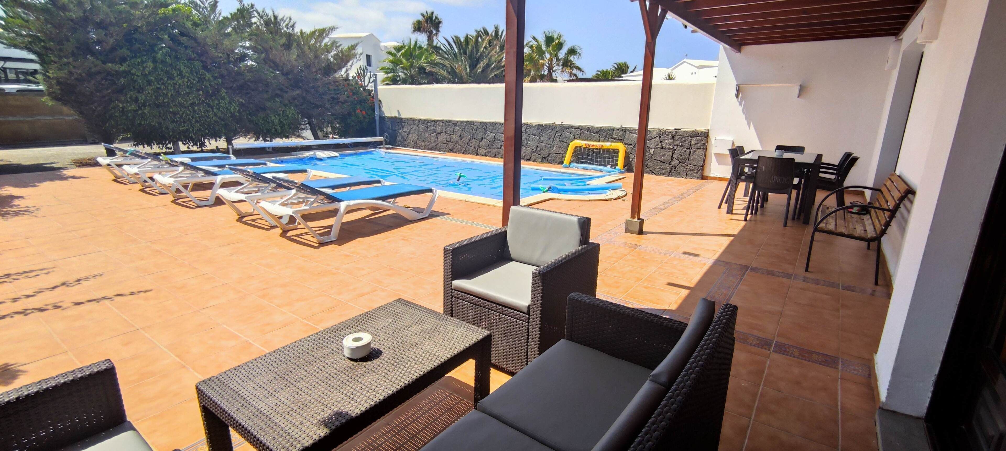 A heated pool, pool loungers