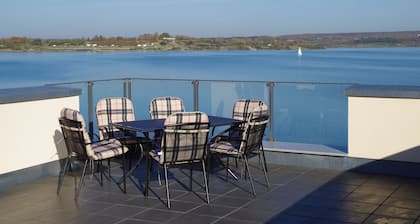 Modern holiday home directly in Hainer lake with boat