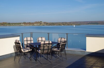 Modern holiday home directly in Hainer lake with boat