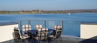 Modern holiday home directly in Hainer lake with boat