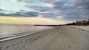 On the beach, sun-loungers