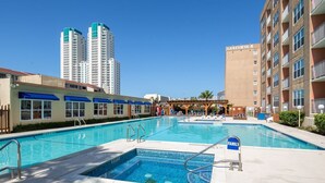 A hotel pool area with a sign reading "FAMILY" and a building labeled "GULFVIEW II" in the background. - FUN VACATION GETAWAY (South Padre Island)