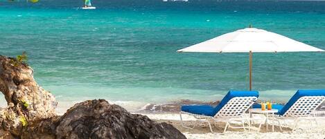 On the beach, sun-loungers, beach towels