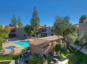 Guests can enjoy a refreshing swim in the pool surrounded by lush gardens and scenic views.