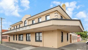 A building with a flat facade, multiple windows, and a sign reading "GRAND CENTRAL B&B." - Grand Central Accommodation B&B Cobden (Cobden)