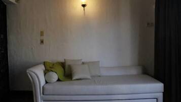Suite Deluxe, 1 camera da letto | Area soggiorno | TV a schermo piatto