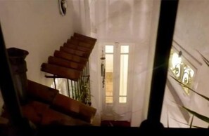 A staircase leading to a door with a window.
